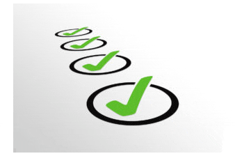 Four checkmarks on paper