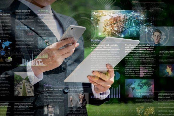Business person looking at ipad and phone improve cpg