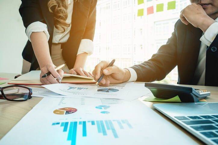 Business people reviewing analytics together